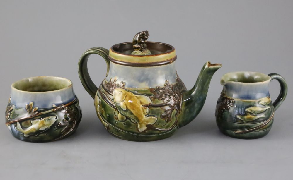 A Royal Doulton fish and pond weed three-piece tea set, designed by George Tinworth, made c.1905, teapot 13cm high